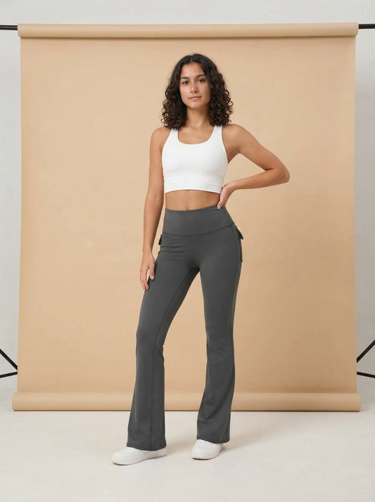 Model wearing the High Waisted Flared Yoga Pants, studio